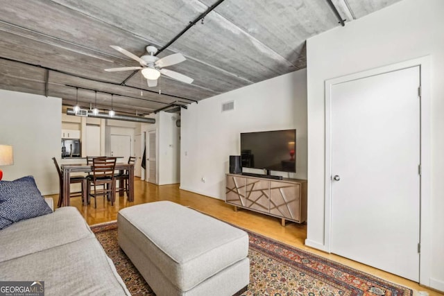 800 Peachtree St NE Unit 2304, Atlanta, GA 30308 - living room with a ceiling fan and wood finished floors
