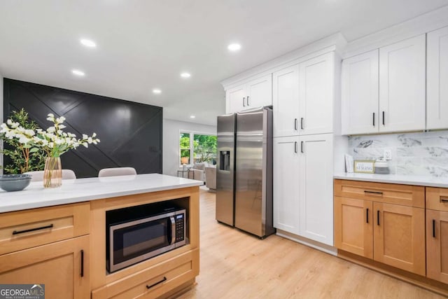 2781 Long Way, Decatur, GA 30032 - kitchen with appliances with stainless steel finishes, light countertops, light wood-style floors, recessed lighting, and backsplash