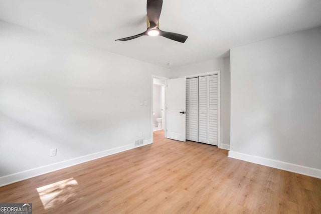 2781 Long Way, Decatur, GA 30032 - unfurnished bedroom with baseboards, wood finished floors, a closet, and ceiling fan