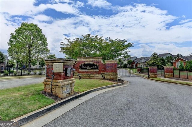 7435 Jamestown Dr, Alpharetta, GA 30005 - community / neighborhood sign featuring a gate and a residential view