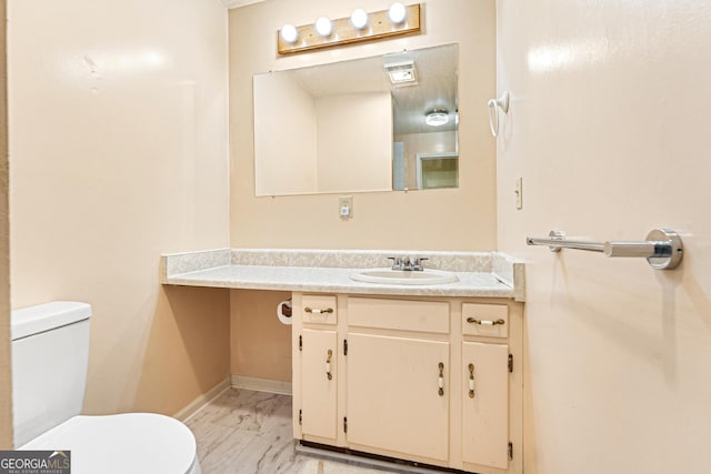 251 Cherokee Dr, Fair Play, SC 29693 - bathroom featuring marble look tile flooring, toilet, vanity, and baseboards