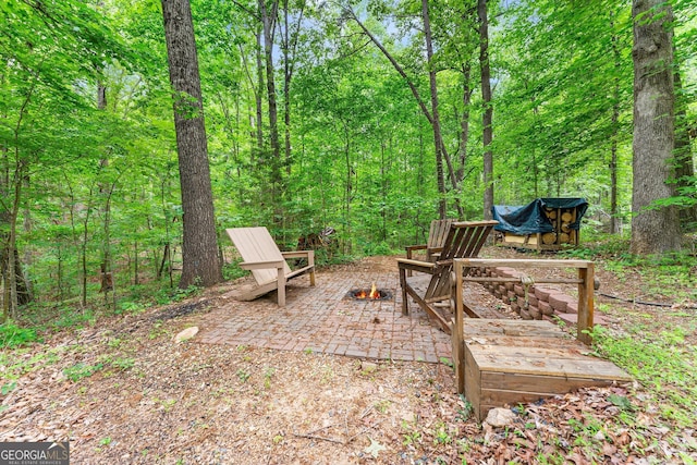 251 Cherokee Dr, Fair Play, SC 29693 - view of yard with a fire pit, a wooded view, and a patio area