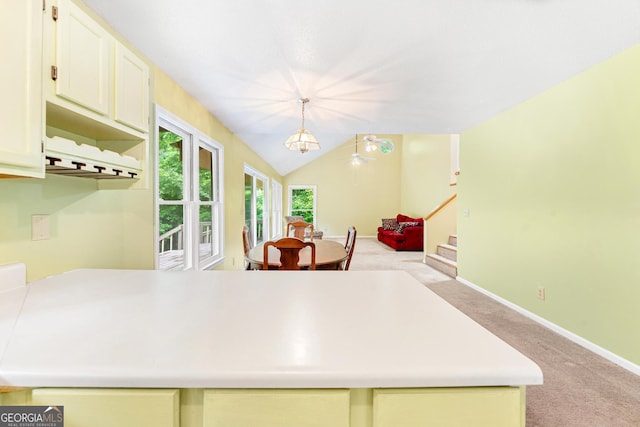 251 Cherokee Dr, Fair Play, SC 29693 - kitchen featuring light carpet, white cabinets, light countertops, baseboards, and decorative light fixtures