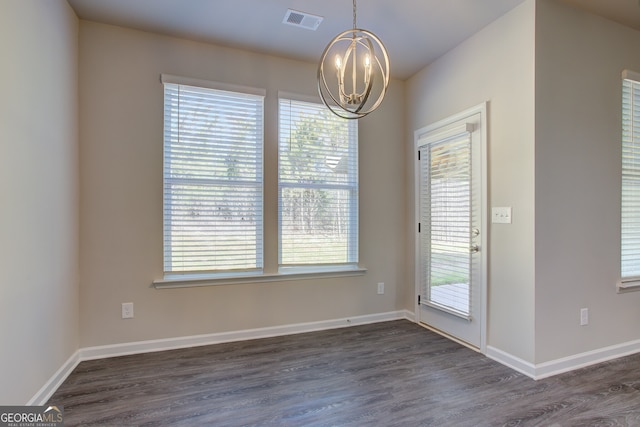 235 Annie Ln, Statham, GA 30666 - unfurnished dining area featuring a chandelier, dark wood-style floors, and baseboards