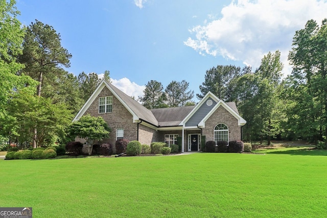 2305 Hawthorne Trce, Monroe, GA 30655 - view of front of home featuring a front yard and brick siding