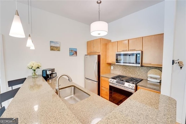 1430 Dresden Dr NE Unit 225, Atlanta, GA 30319 - kitchen featuring stainless steel appliances, a sink, decorative backsplash, light brown cabinetry, and light stone counters