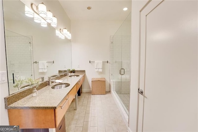 1430 Dresden Dr NE Unit 225, Atlanta, GA 30319 - bathroom featuring a stall shower, double vanity, recessed lighting, and baseboards