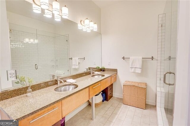 1430 Dresden Dr NE Unit 225, Atlanta, GA 30319 - full bath with a stall shower, double vanity, baseboards, and tile patterned flooring