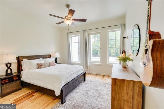 1430 Dresden Dr NE Unit 225, Atlanta, GA 30319 - bedroom featuring multiple windows, light wood-style flooring, and ceiling fan