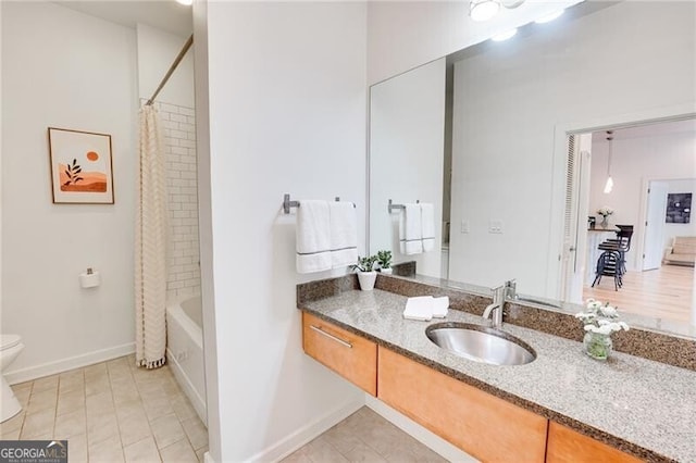 1430 Dresden Dr NE Unit 225, Atlanta, GA 30319 - bathroom featuring vanity, toilet, baseboards, shower / bathtub combination with curtain, and tile patterned floors