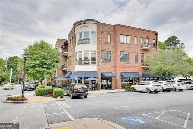 1430 Dresden Dr NE Unit 225, Atlanta, GA 30319 - view of building exterior featuring uncovered parking