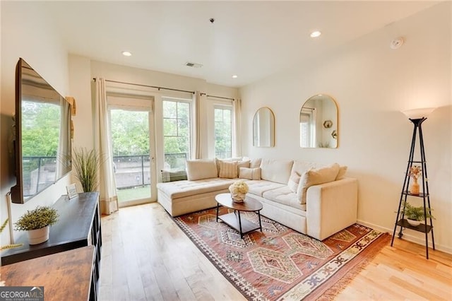 1430 Dresden Dr NE Unit 225, Atlanta, GA 30319 - living room featuring wood finished floors and recessed lighting
