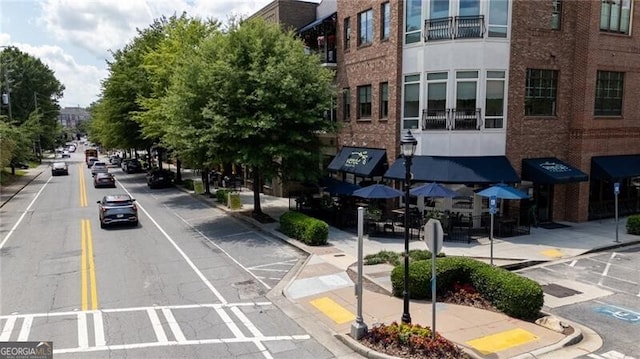1430 Dresden Dr NE Unit 225, Atlanta, GA 30319 - view of asphalt street featuring sidewalks, curbs, and street lights