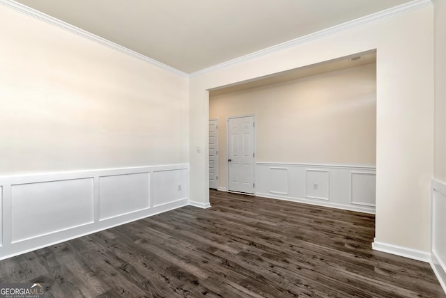 673 Graham Campbell Ln, Statham, GA 30666 - empty room with ornamental molding, a decorative wall, dark wood-style flooring, and a wainscoted wall