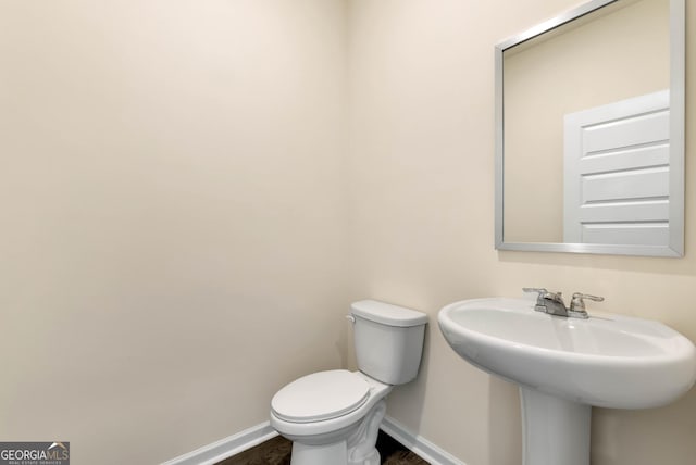 673 Graham Campbell Ln, Statham, GA 30666 - bathroom with baseboards and wood finished floors
