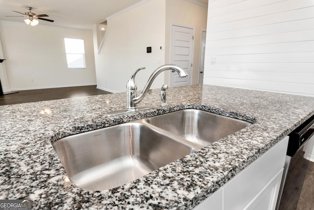 673 Graham Campbell Ln, Statham, GA 30666 - kitchen view of stone counters, a ceiling fan, wood finished floors, dishwashing machine, and white cabinetry
