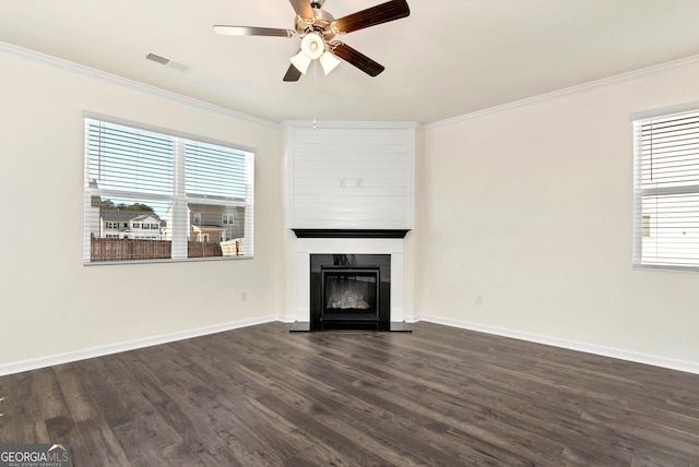 673 Graham Campbell Ln, Statham, GA 30666 - unfurnished living room featuring ceiling fan, crown molding, a large fireplace, plenty of natural light, and dark wood-style flooring