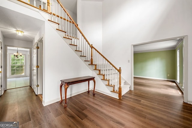 1387 Wynford Gate SW, Marietta, GA 30064 - stairway with a chandelier, wood finished floors, baseboards, and a high ceiling