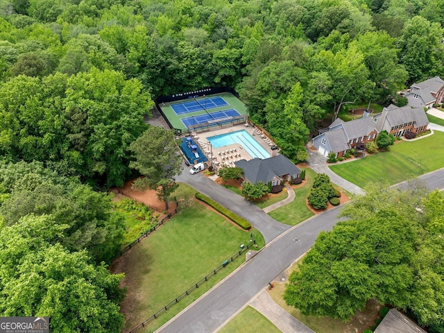 1387 Wynford Gate SW, Marietta, GA 30064 - drone / aerial view of a pool and a heavily wooded area