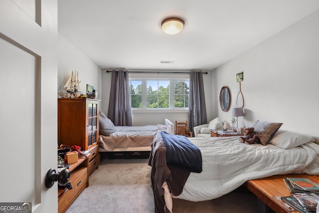 bedroom with light carpet