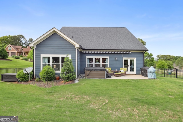 back of house with a hot tub, a patio area, outdoor lounge area, roof with shingles, and french doors