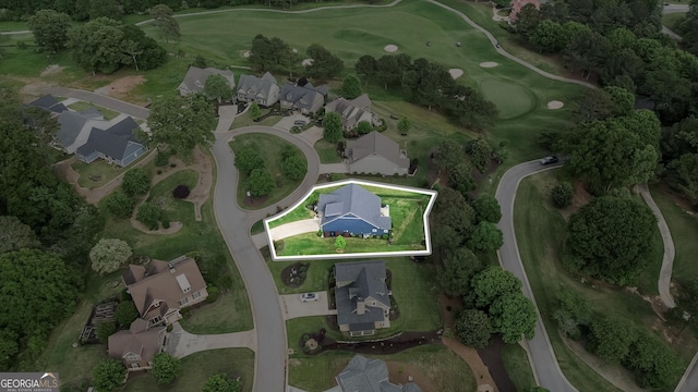 aerial view of property and surrounding area with property parcel outlined and a golf course