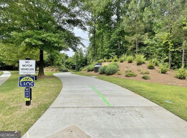 44 Arbor Way, Newnan, GA 30265 - view of community with a lawn and concrete driveway