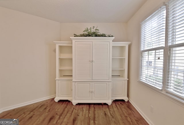 44 Arbor Way, Newnan, GA 30265 - unfurnished dining area featuring light wood-type flooring and baseboards