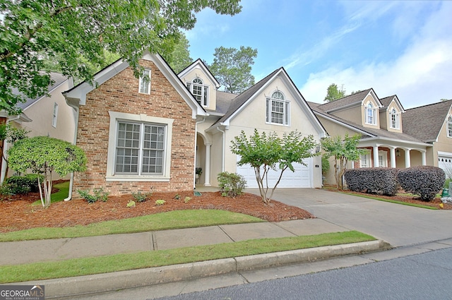 44 Arbor Way, Newnan, GA 30265 - traditional-style home with driveway, a garage, and stucco siding