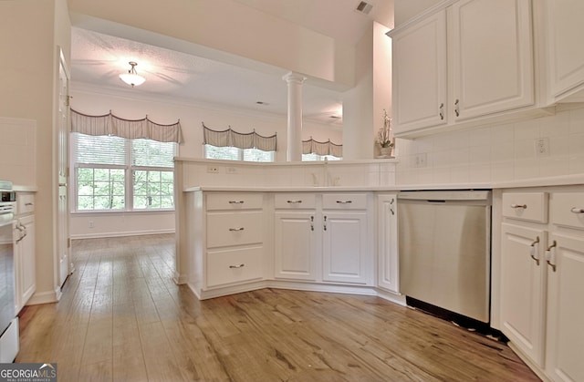 44 Arbor Way, Newnan, GA 30265 - kitchen featuring dishwasher, crown molding, light wood-style flooring, backsplash, and white cabinetry