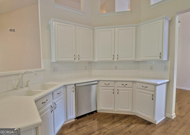 44 Arbor Way, Newnan, GA 30265 - kitchen with dishwasher, a sink, decorative backsplash, and wood finished floors