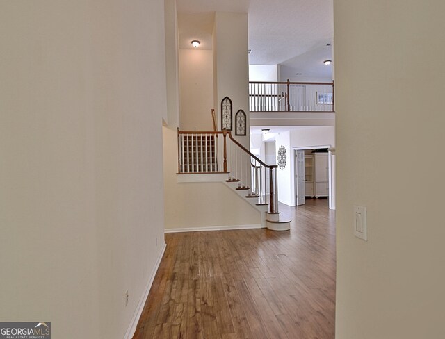 44 Arbor Way, Newnan, GA 30265 - stairs featuring hardwood / wood-style flooring and baseboards