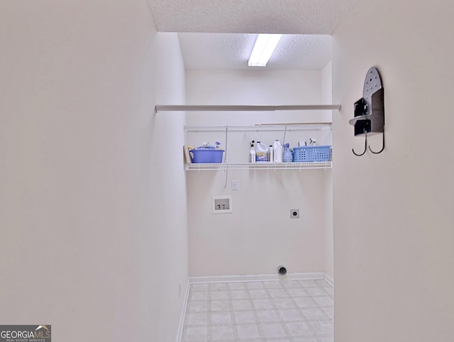 44 Arbor Way, Newnan, GA 30265 - laundry room featuring hookup for a washing machine, tile patterned floors, electric dryer hookup, a textured ceiling, and baseboards