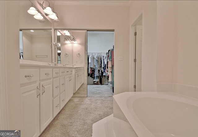 44 Arbor Way, Newnan, GA 30265 - bathroom featuring a garden tub, double vanity, crown molding, a walk in closet, and a chandelier