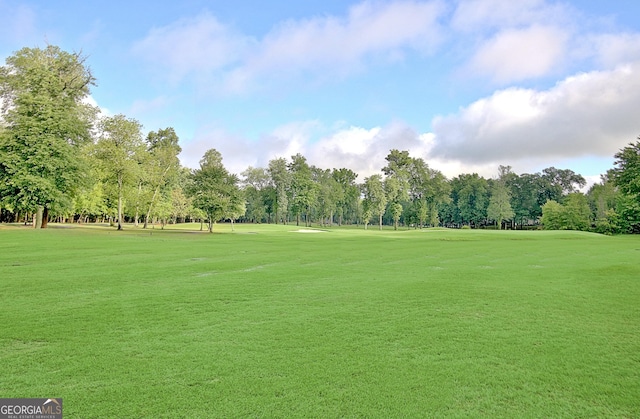 44 Arbor Way, Newnan, GA 30265 - view of community featuring view of wooded area, golf course view, and a lawn