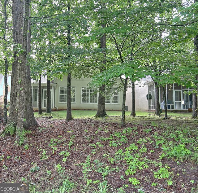 44 Arbor Way, Newnan, GA 30265 - back of property featuring a sunroom and stucco siding