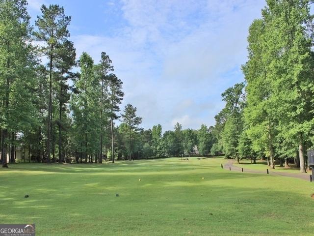 44 Arbor Way, Newnan, GA 30265 - view of community with a yard and view of wooded area
