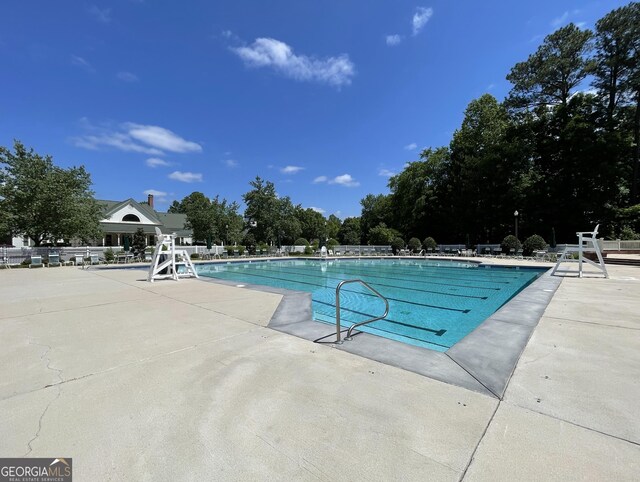 44 Arbor Way, Newnan, GA 30265 - community pool featuring a patio and fence