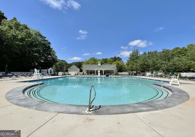 44 Arbor Way, Newnan, GA 30265 - community pool featuring fence, a patio, and view of scattered trees