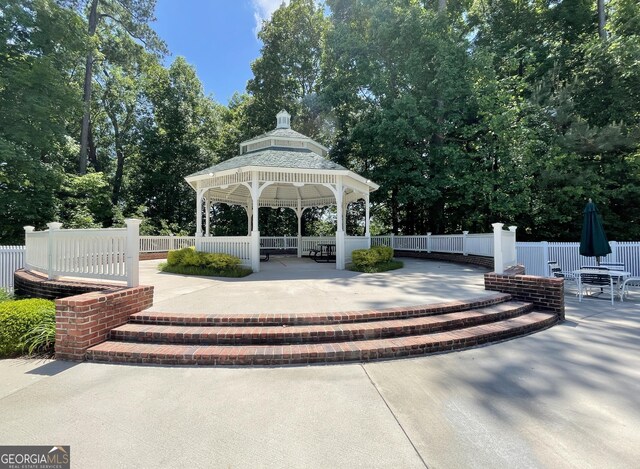 44 Arbor Way, Newnan, GA 30265 - surrounding community with a gazebo, a patio, fence, and view of wooded area