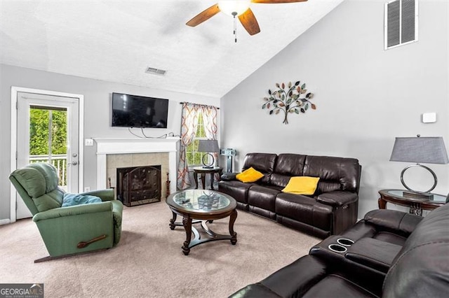 995 Chimney Trace Way, Lawrenceville, GA 30045 - carpeted living room featuring ceiling fan, vaulted ceiling, and a tiled fireplace