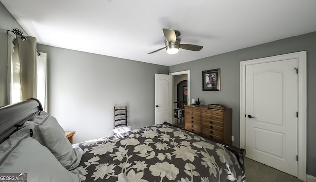 carpeted bedroom with a ceiling fan