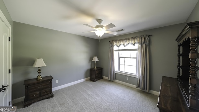 unfurnished bedroom featuring carpet, baseboards, and ceiling fan
