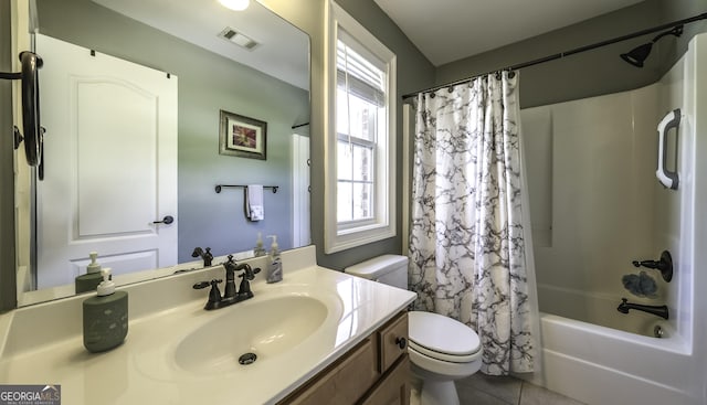 bathroom featuring toilet, tile patterned floors, vanity, and shower / bathtub combination with curtain
