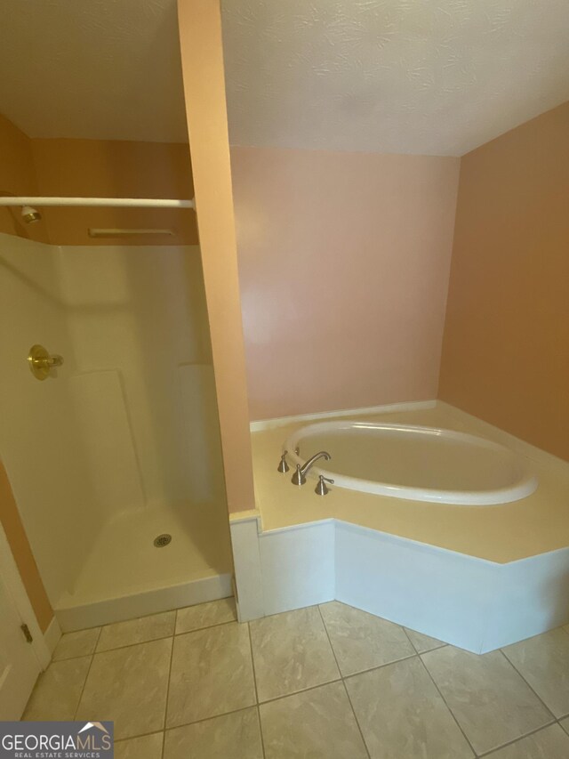 1669 Azalea Dr, Lawrenceville, GA 30043 - full bathroom with tile patterned flooring, a walk in shower, and a bath