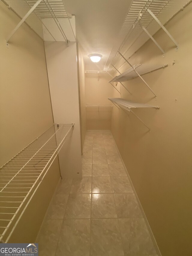1669 Azalea Dr, Lawrenceville, GA 30043 - walk in closet with tile patterned flooring