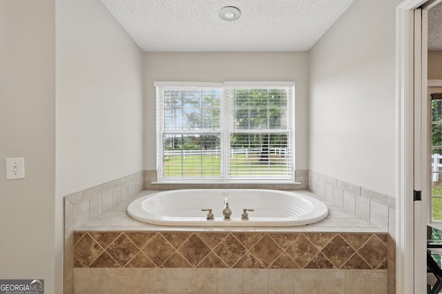 194 Retreat Pl, Woodbine, GA 31569 - bathroom featuring a garden tub and a textured ceiling