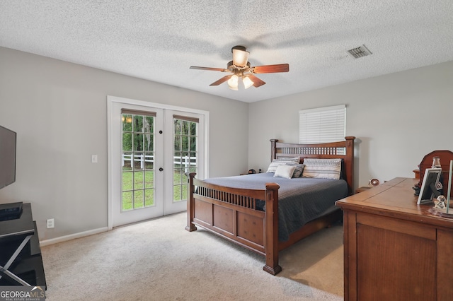 194 Retreat Pl, Woodbine, GA 31569 - carpeted bedroom with access to exterior, french doors, a ceiling fan, and a textured ceiling