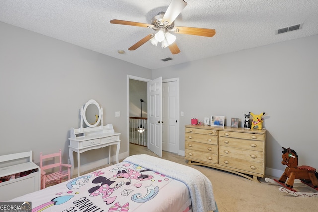 194 Retreat Pl, Woodbine, GA 31569 - bedroom featuring light colored carpet, a textured ceiling, a closet, and ceiling fan
