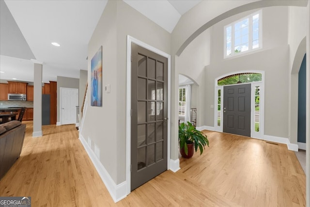 7049 Bennington Ln, Cumming, GA 30041 - foyer featuring light wood-style floors, recessed lighting, and a towering ceiling